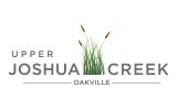 Upper Joshua Creek logo with blades of grass between text Joshua and Creek. 