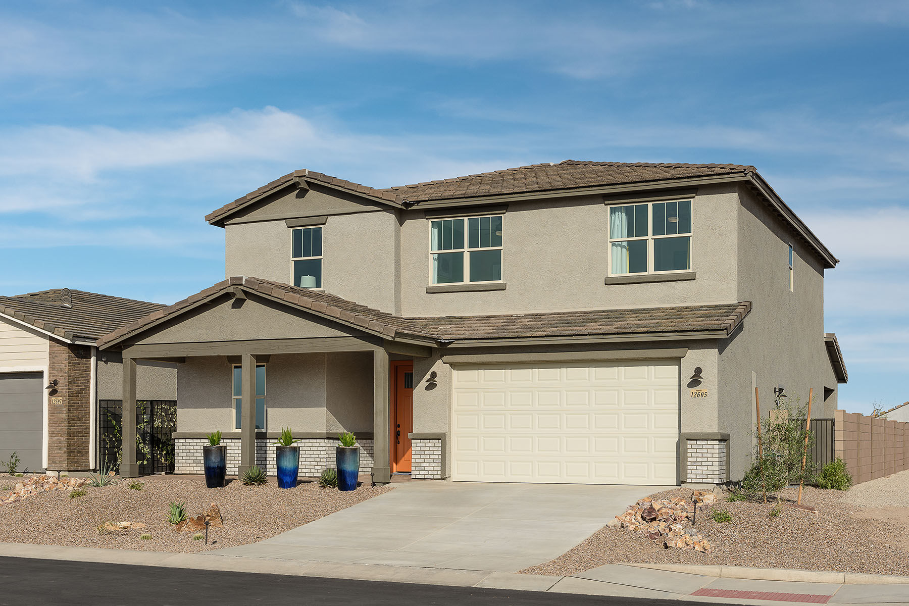 Elevation Front with door, window, garage, exterior stucco