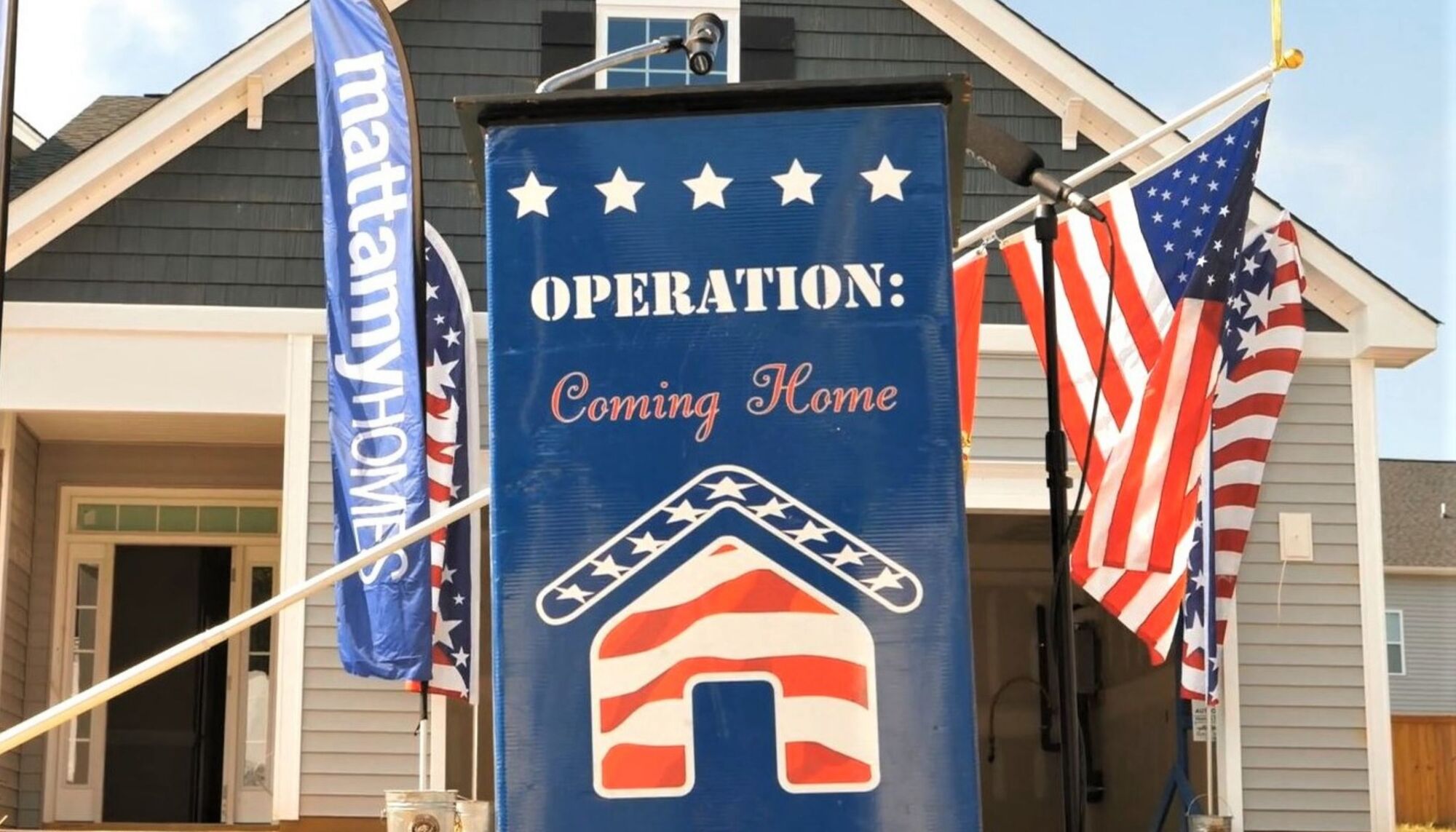 Operation: Coming Home banner displayed along with Mattamy Homes logo and American flag with new home behind them