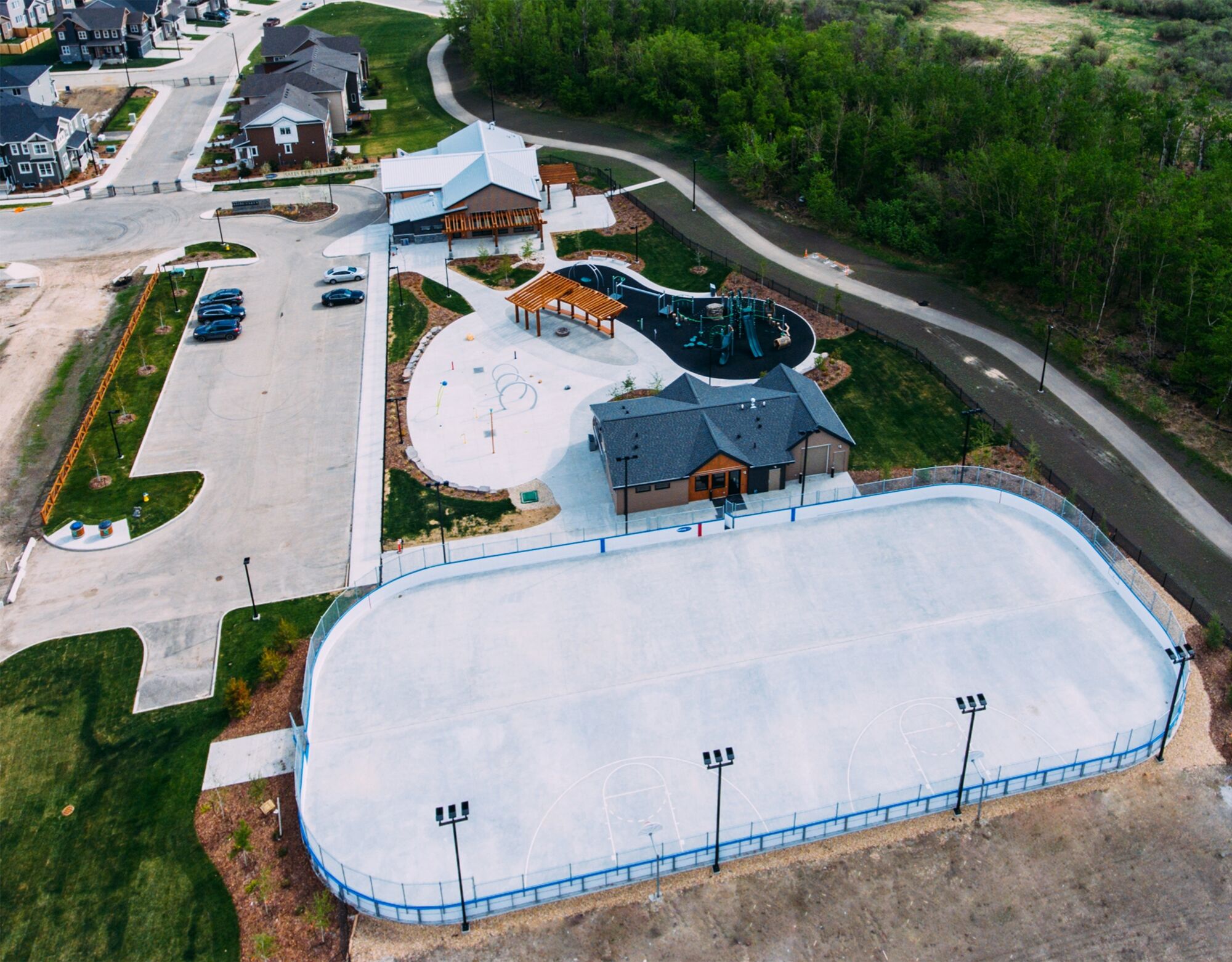 An overhead view of a parkette and an outdoor ice rink.