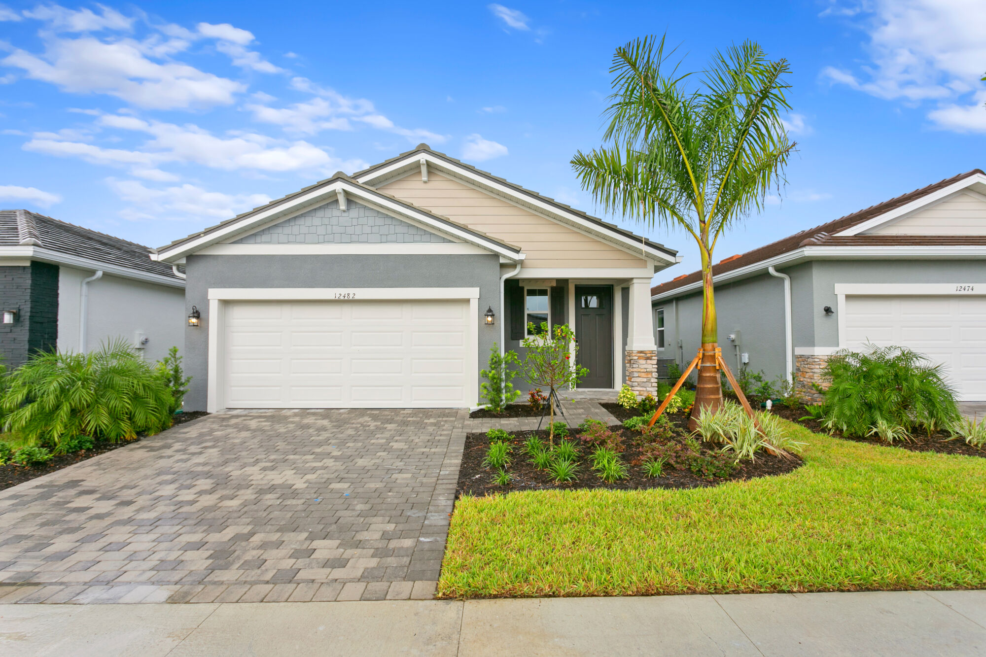 3 bedroom, 2 bath, 2 car garage, paver drive, walkway and lanai, single-family home, quartz countertops, plank tile floors, 42" upper cabinets, open floor plan, level yard, landscaped, palm trees, sod, irrigation 