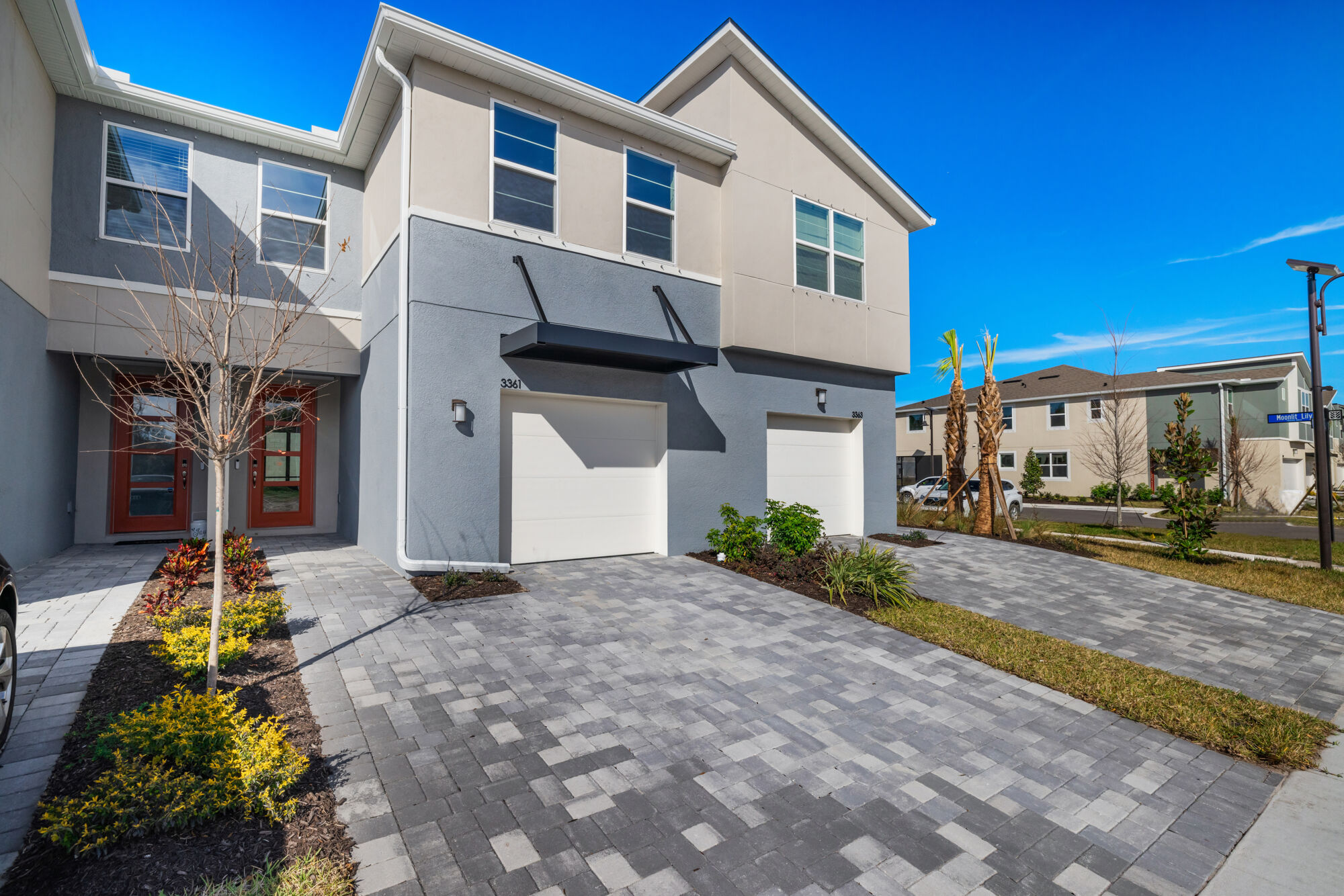 townhome, 3 bedroom, 2.5 baths, contemporary exterior, loft, open concept, walk-in closet, powder room, plank style tile flooring, gated community