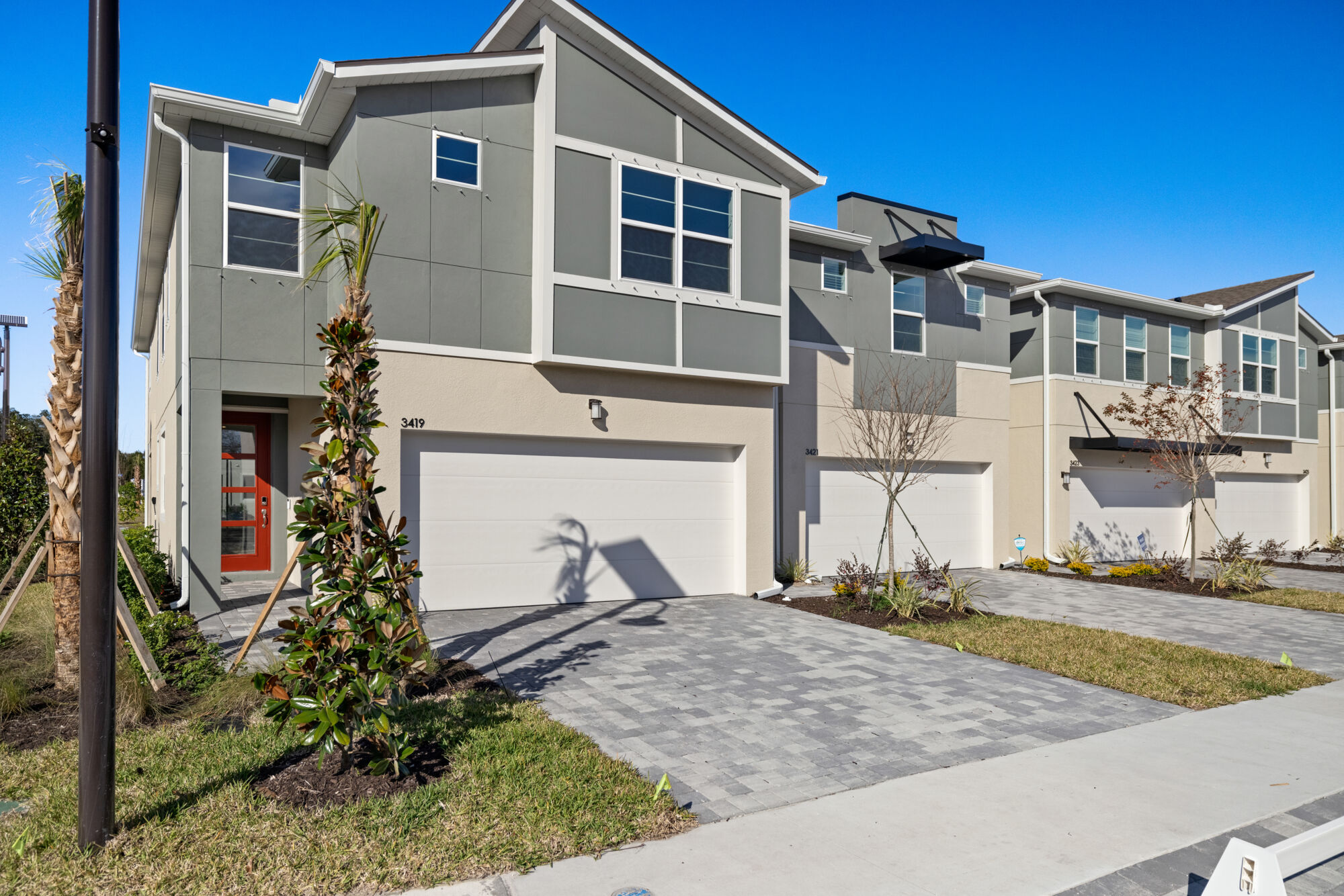 townhome, 4 bedrooms, 3 baths, end unit, one bedroom and full bath on main level, loft/game room combo, owner's bath oasis with soaking tub and separate shower, separate vanities, luxury vinyl plank flooring, open concept floorplan, contemporary exterior
