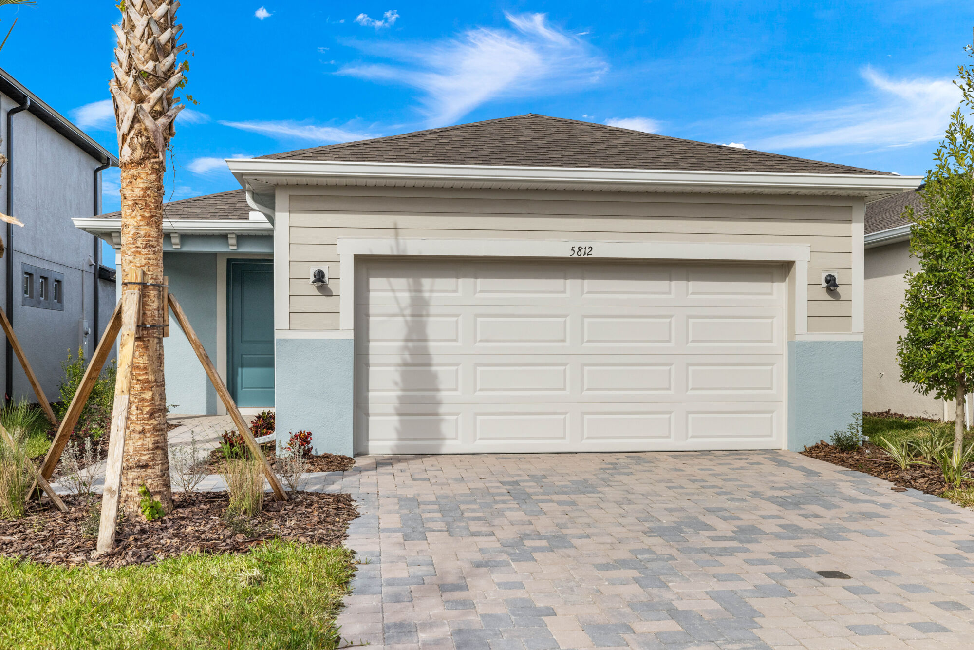 Single family 2 bedroom, 2 bathroom, 2-car garage home with a study. plank style tile flooring, island with breakfast bar, stainless steel appliances including the refrigerator, triple glass sliders, screened lanai, pavers, glass enclosed showers, 