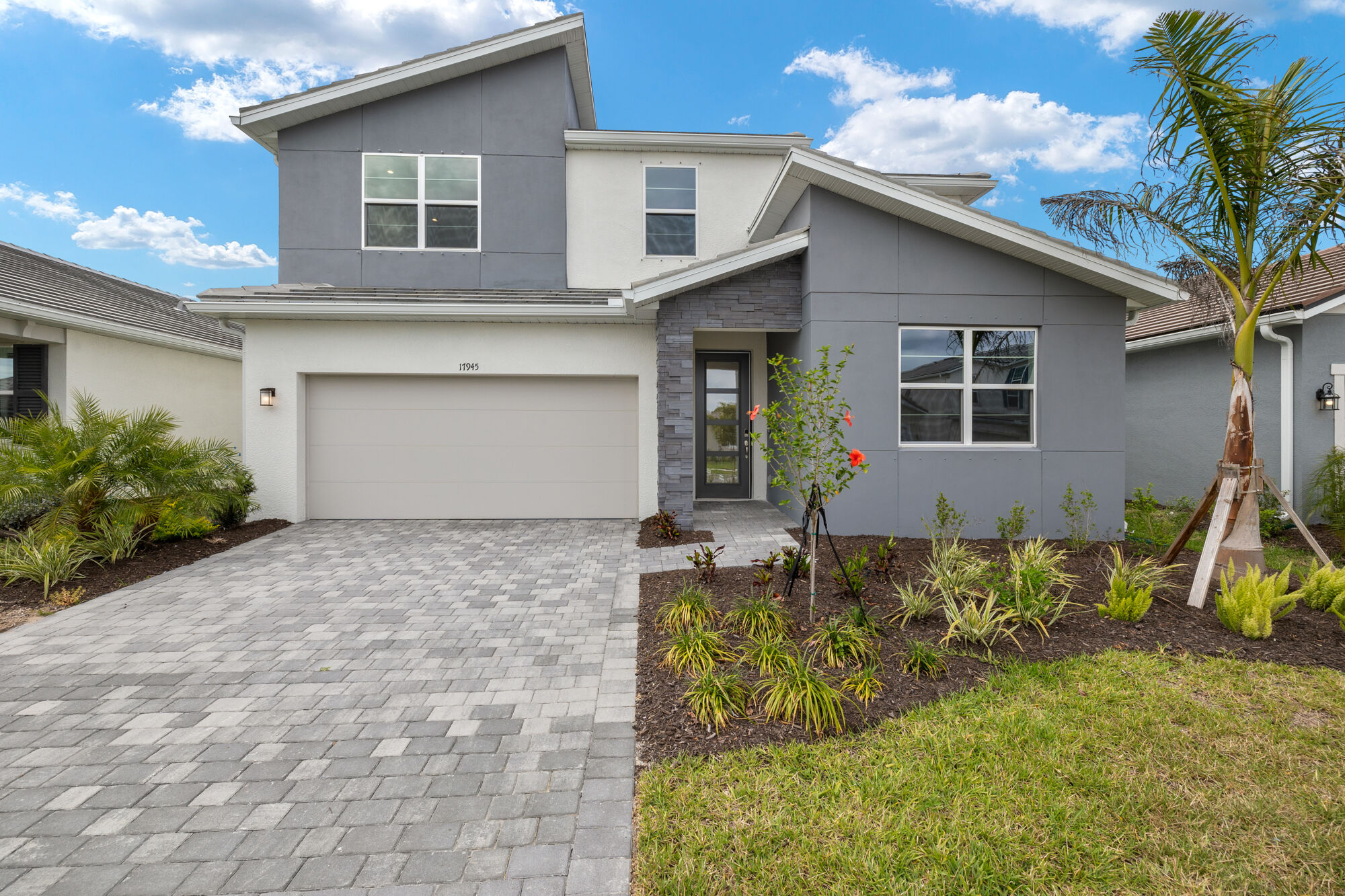 5 bedrooms, 3 baths, two story, extended lanai, executive kitchen, butlers pantry, study, bed and bath on main floor, walk-in closets, island breakfast bar, luxury vinyl lank flooring Modern Exterior