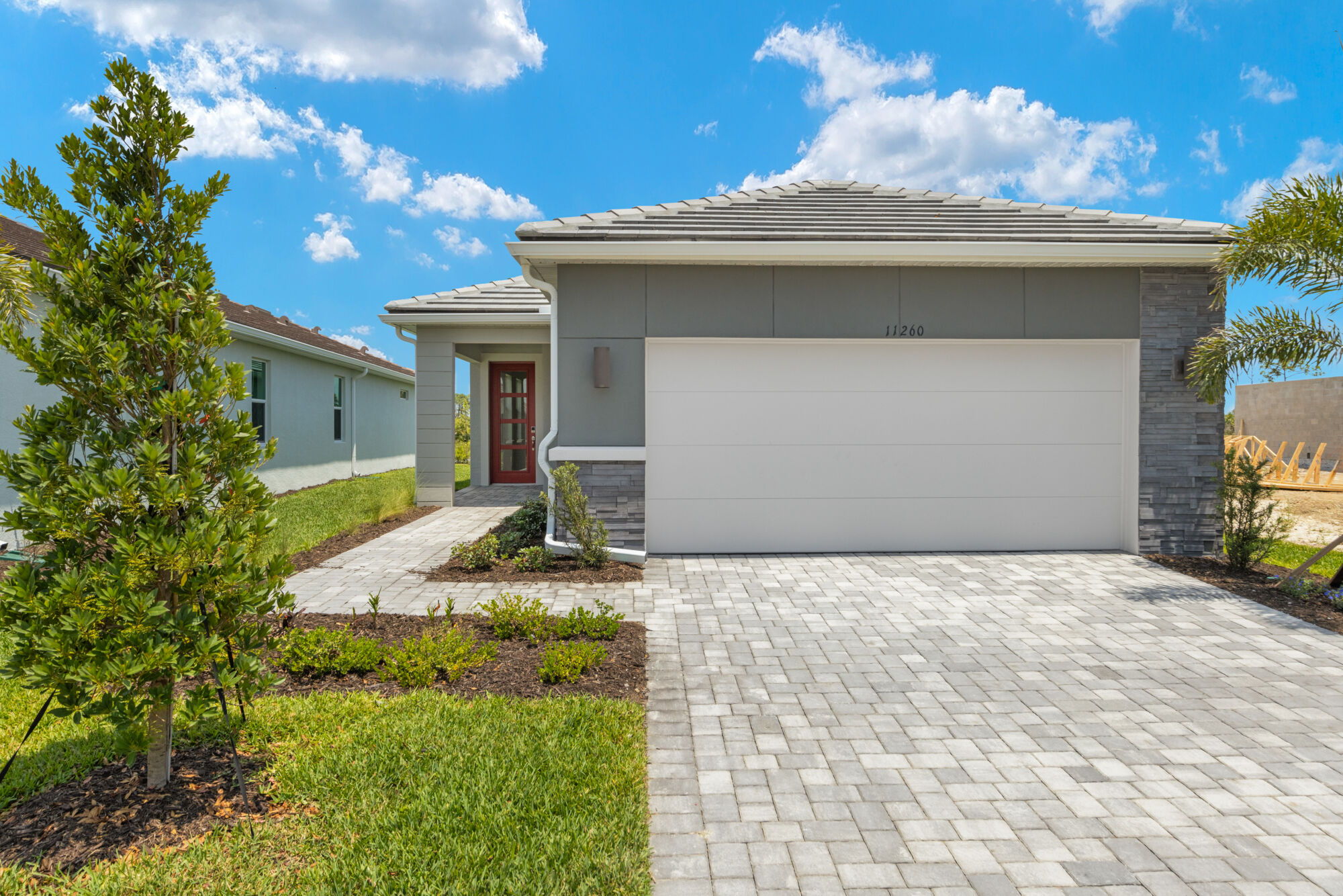 Single family, 2 bedroom, 2 bath, extended 2-car garage, open kitchen, dining and great room, owner's suite with walk-in closet, extended shower, dual sink raised vanity, split bedroom plan, luxury vinyl plank flooring, breakfast bar, oversized sliderts to lanai