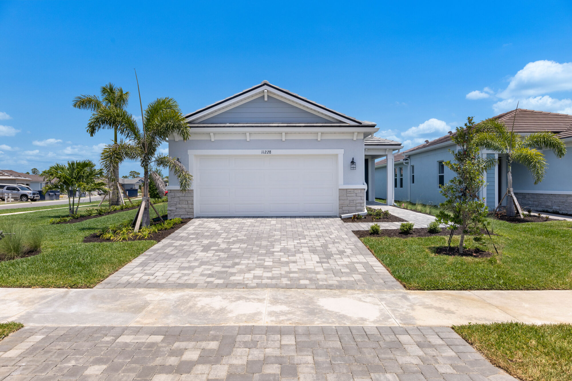 single family home, extended 2-car garage, open kitchen, dining and great room, 12' sliders to lanai, 2 bedroom, 2 bathrooms, owners suite with walk-in closet, extended shower