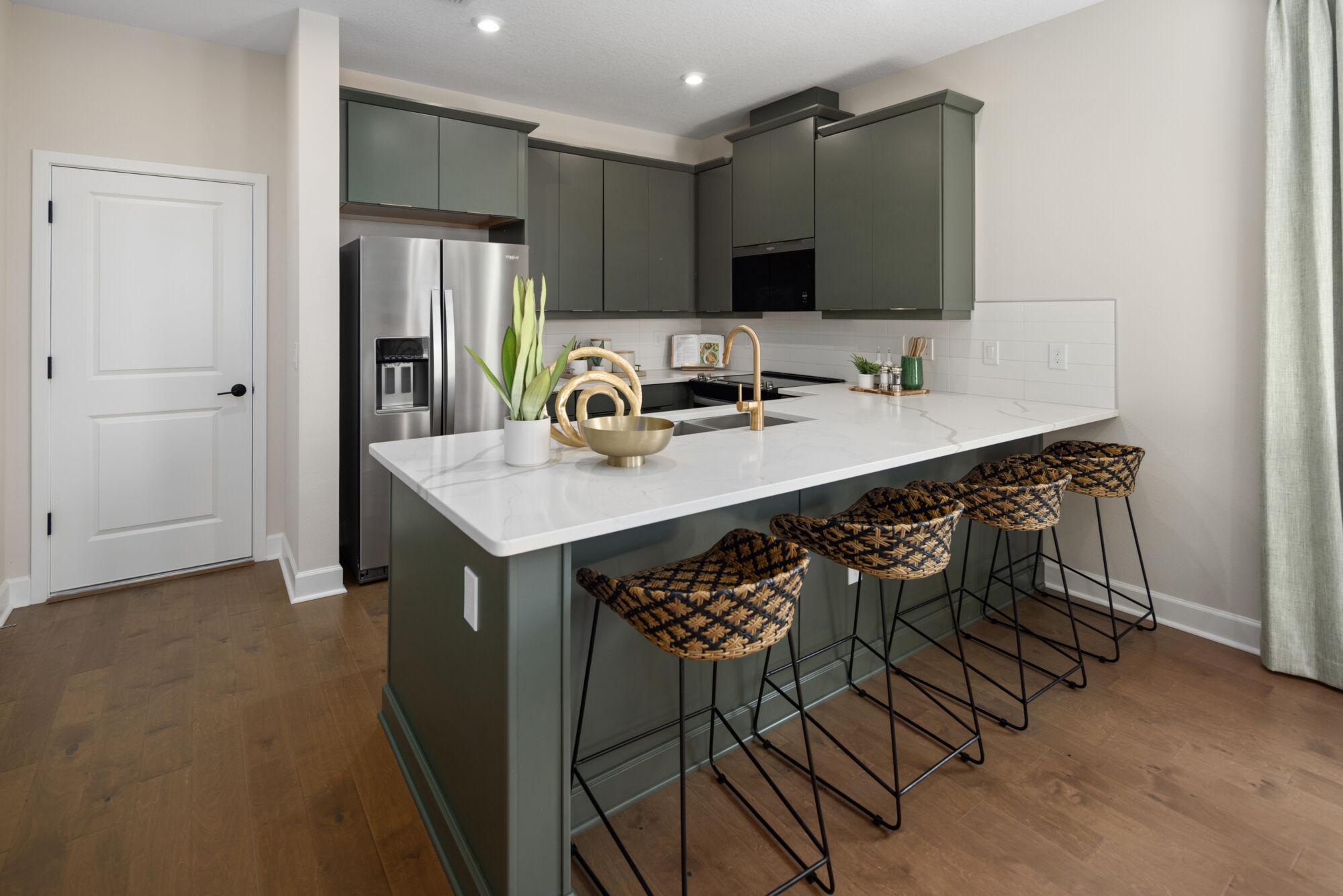  Kitchen with door, refrigerator, curtains and wood flooring