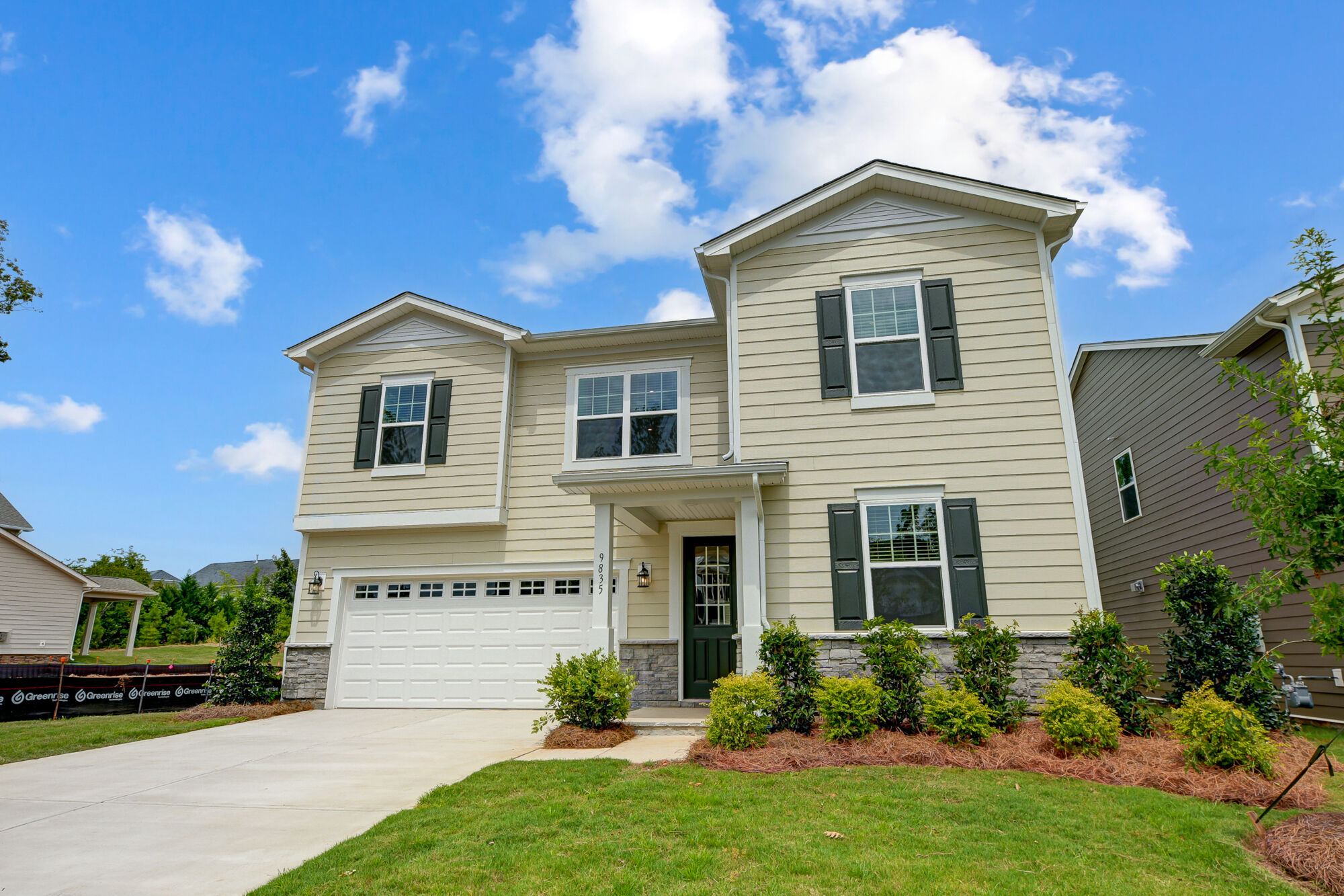  Elevation Front with window, garage, door and exterior clapboard