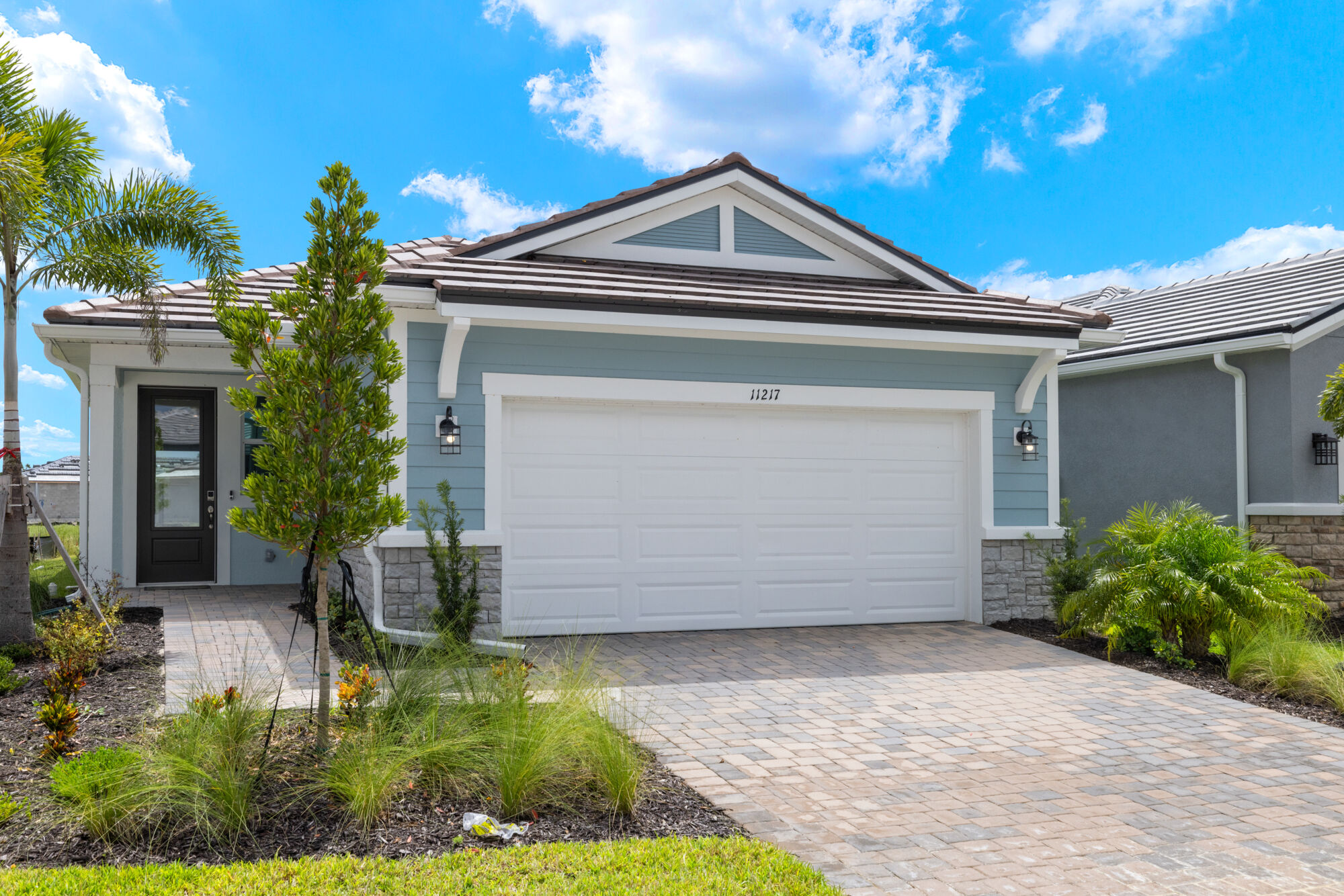 single story, executive kitchen, study, 2 bedroom, 2 bathroom, 2-car garage, oversized sliders, covered lanai, walk-in closet in owner's bath, open concept floor plan, quartz countertops, oversized shower, luxury vinyl plank flooring