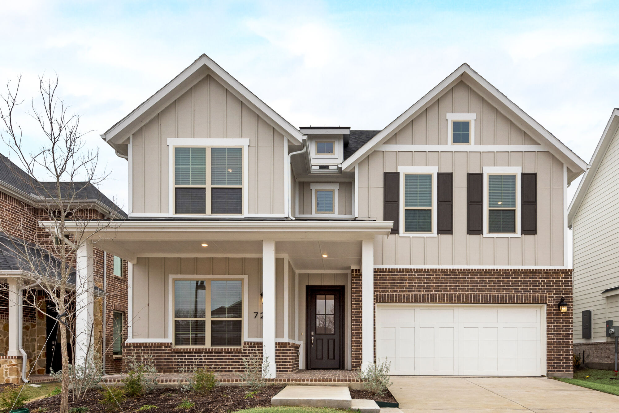 Elevation Front with window, garage, door, exterior brick and exterior clapboard