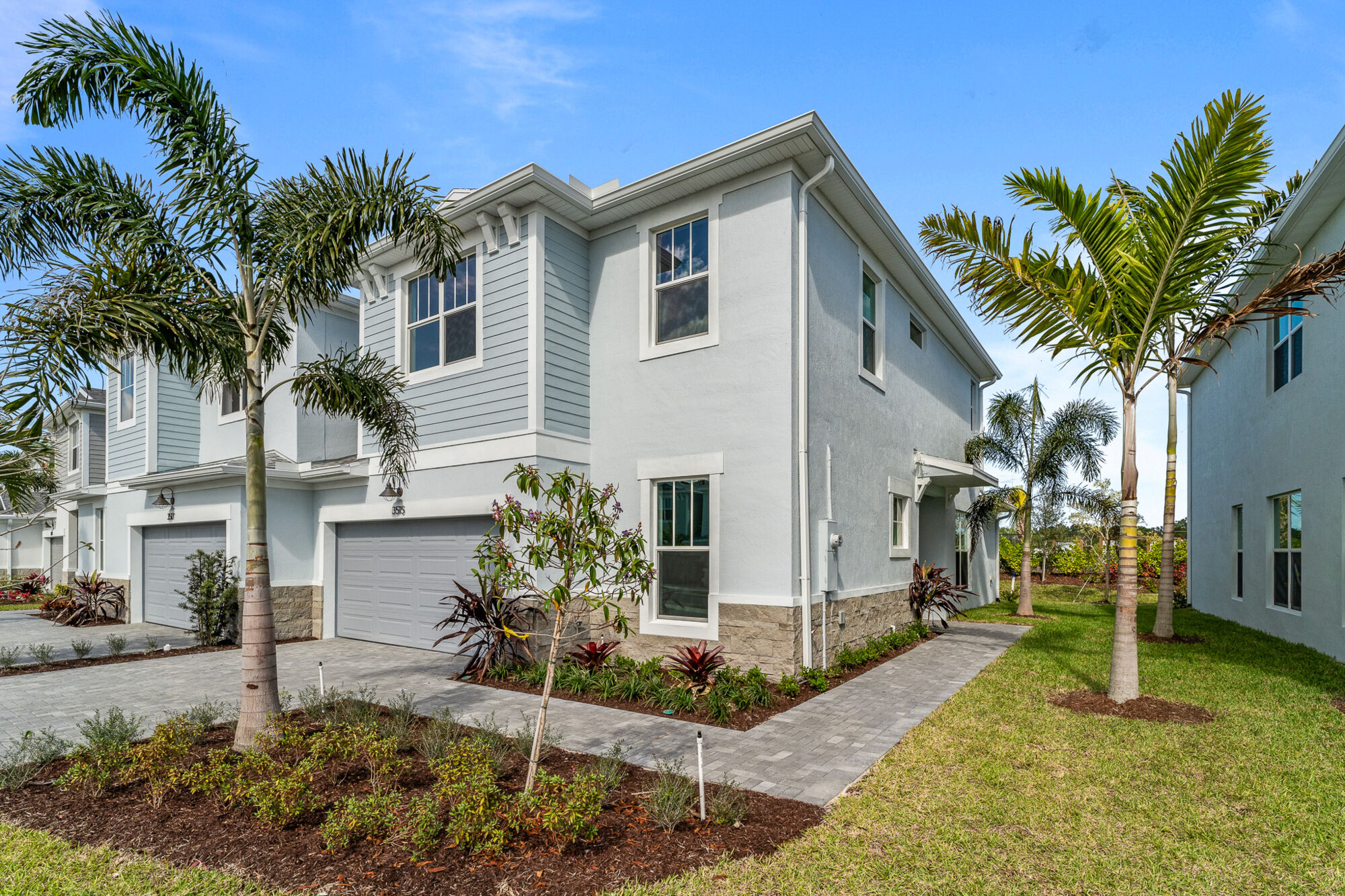  Elevation Back Side with garage, window and exterior clapboard